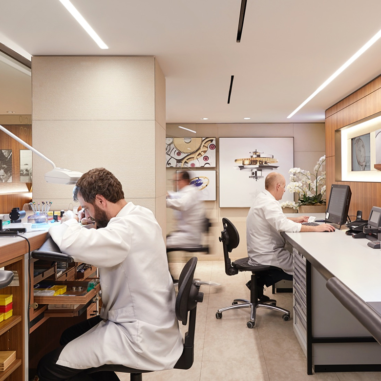 Rolex watchmakers at work in a Rolex servicing workshop